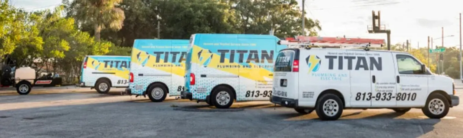 Titan Plumbing and Electric service vans in Tampa Titan Plumbing and Electric service vans lined up in Tampa